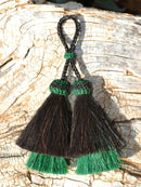 Close Up View 3" Double mule tail cut natural and brightly colored tassels. Handmade from horsehair dyed in bright colors as well as natural.      Black/Green