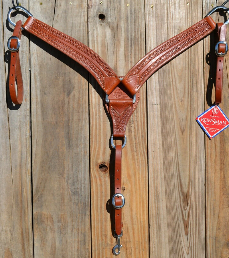 Reinsman Heavy Duty 2" Double Ply Leather Breast Collar with Hand Carved with Snake border tooling.  Warm mahogany color leather.  Stainless steel hardware and tugs and cinch drop.   1" x 12" adjustable tugs. 