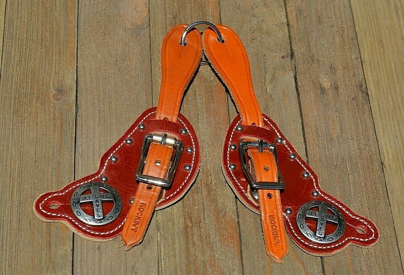 Rocking Y Saddlery Shaped Kids/Youthy Spur Straps with Cross Conchos.  Two-ply with burgundy brown color patent overlay and stainless steel spots.  Cross conchos are removable and replaceable. 