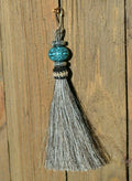 Close Up View 4 1/2" total length horsehair zipper pull with spring clip. Handmade horsehair various colors and beading pattern. Grey-Silver/RTurquoise/Silver
