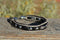 Close Up View Awesome 3/8" wide, 3 Strand Braided Horsehair Bracelet with a lobster claw clasp and various colored and patterned bone beads. White/Black/Black