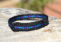 Awesome 1/2" wide, 3 Strand Braided Horsehair Bracelet with sliding knot.  The unique sliding knot XL design expands up to 10".  Unisex.  Very durable and makes a great gift for any horse lover. Black/Purple/Turquoise