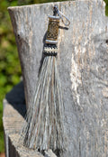 Close Up View 4 1/2" total length horsehair zipper pull with spring clip. Handmade horsehair various colors and beading pattern. Grey-Silver/Gold/Silver
