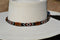 Close Up View Beautiful 1/2" Hand Made Beaded Hatband with Long Bone Beads.  Made from 7 strands of black, brown and white beads and 1" wide amber color bone beads. 