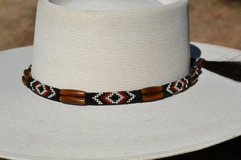 Close Up View Beautiful 1/2" Hand Made Beaded Hatband with Long Bone Beads.  Made from 7 strands of black, brown and white beads and 1" wide amber color bone beads. 