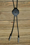 Close Up View Western Style Black Braided Leather Bolo Tie with amazing southwest design diamond shape concho slide with a matt black background and enamel center accent. 