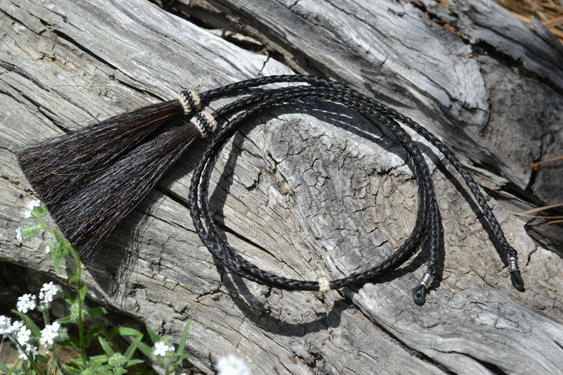 Close Up View Western Style 1/4" wide and 24" long, braided horse hair eye glass holder (gator/leash) with tassels. Black