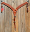 Reinsman Heavy Duty 2" Double Ply Contoured Breast Collar with Hand Carved with Snowflake Tooling.    Stainless steel hardware and tugs.   1" x 12" adjustable elastic tugs.   Mahogany color.