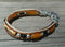 Close Up View Awesome 3/8" wide, 3 Strand Braided Horsehair Bracelet with a lobster claw clasp and various colored and patterned bone beads. White/Chestnut