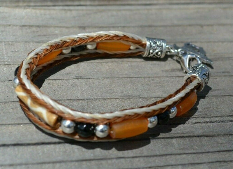 Close Up View Awesome 3/8" wide, 3 Strand Braided Horsehair Bracelet with a lobster claw clasp and various colored and patterned bone beads. White/Chestnut