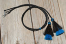 Close Up View natural horse hair Stampede String with two bell mule tail cut tassels and cotter pin attachments.     Black/Black/Turquoise