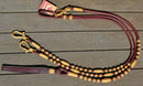 Beautiful Hand Braided Latigo Leather Romel Reins, 12 plait Hand Braided Natural Rawhide braided in the Oklahoma style with round knots. 