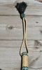 Close Up View Beautiful Jose Ortiz Braided Rawhide Quirt Whip with Hitched Horsehair Knots and Hand Tooled Leather Popper. Natural colored rawhide with turquoise blue and black details. 