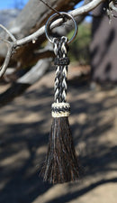 Close Up View 3/8" wide, 3 Strand Braided Horsehair Key Chain. This shorter style is 5 1/2" including the key ring.   White/Black/Black