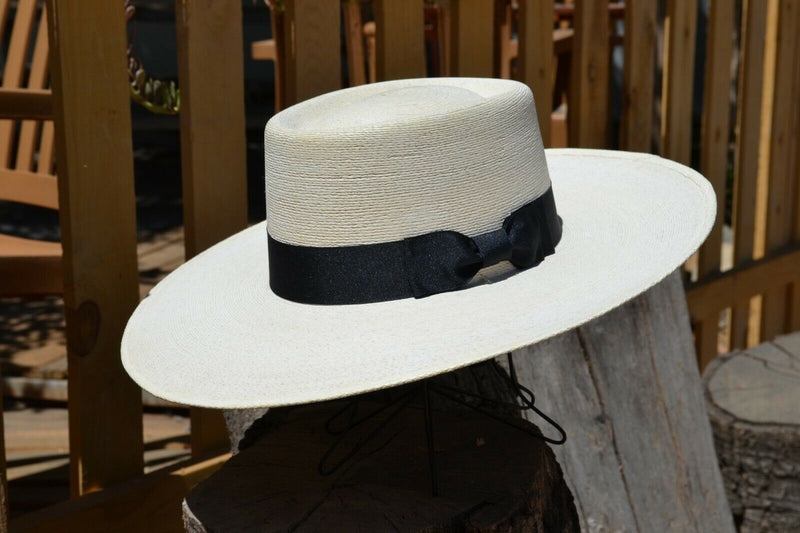 Atwood Hat Company - 4.25" Flat Brim Buckaroo Style Hat - Long Oval - 7X Palm Leaf - Designed with a buckaroo brim, the flat brim with a slight tilt down in front and curl up in the back.  Hatband is a wide black ribbon with traditional bow.
