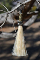 Close Up View 4 1/2" total length horsehair zipper pull with spring clip. Handmade horsehair various colors and beading pattern. White-Silver/Gold/Silver