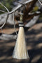 Close Up View 4 1/2" total length horsehair zipper pull with spring clip. Handmade horsehair various colors and beading pattern. White-Silver/Gold/Silver