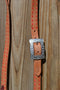 Close Up View Jose Ortiz 1" One/Single Split Ear Headstall.  Constructed of single-ply natural harness leather with red leather buckstitched by hand. 