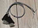 Close Up View natural horse hair Stampede String with two bell mule tail cut tassels and cotter pin attachments.    Grey/Black/Grey