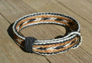 Awesome 5/8" wide, 5 Strand Braided Horsehair Bracelet with sliding knot.  The unique sliding knot design can expand up to 10".  Unisex.  Very durable and makes a great gift for any horse lover. White/Chestnut/Black/White