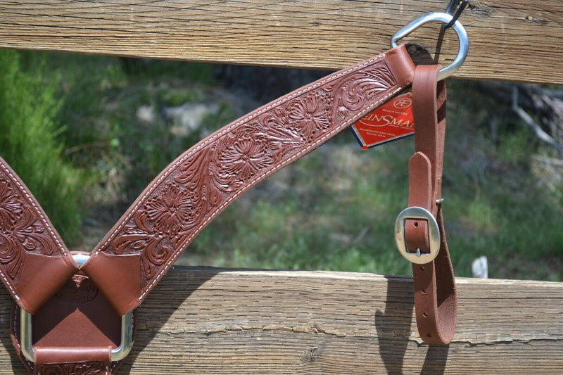 Close Up Reinsman Heavy Duty 2 3/4" Heavy Oil Harness Leather Breast Collar with Hand Carved Wyoming Flower tooling.  Stainless steel hardware and tugs and cinch drop. 