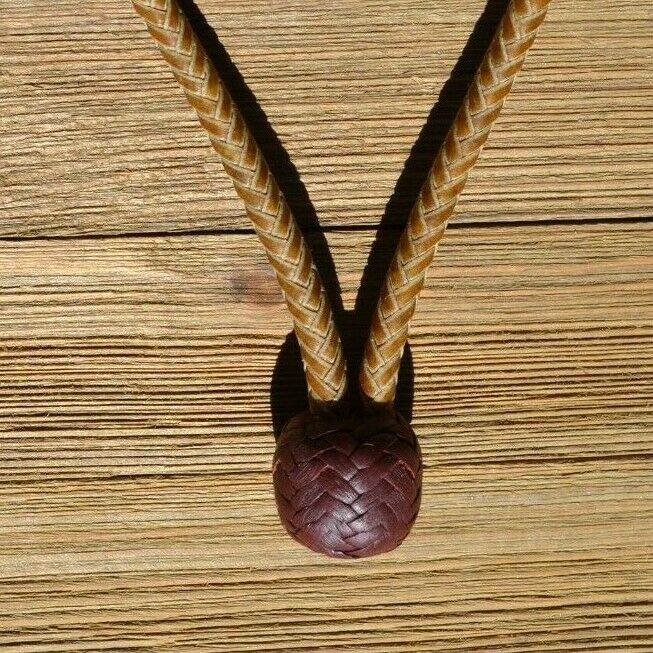 1/4" hand braided rawhide pencil bosal with latigo leather nose & knot with a rawhide core.  Noseband measures 1/2" wide at the thickest point