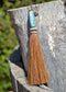 Close Up View 4 1/2" total length horsehair zipper pull with spring clip. Handmade horsehair various colors and beading pattern. Sorrel-Turquoise