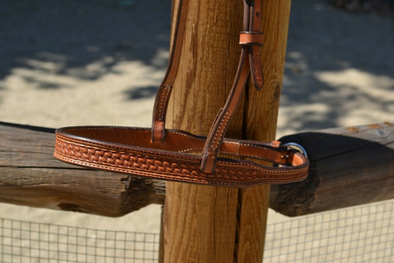 Close Up View Tooling Jose Ortiz has made these 1" wide beautiful light russet oil bridle leather adjustable western training cavesons with hand carved basket weave tooling.     Stainless steel buckle attachment has plenty of crown adjustment.  Noseband and adjusts from 20"-22" around.