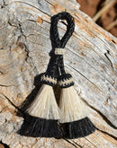 Close Up View 2" Double two Bell mule tail cut natural and brightly colored tassels. Handmade from horsehair dyed in bright colors as well as natural.   White/Black