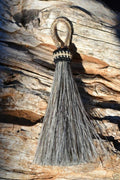 Close Up View 3" - 4 1/2" total length natural horsehair tassels. Handmade with 1 1/2" braided horsehair knot loop.    Grey
