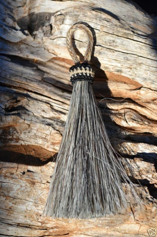 Close Up View 3" - 4 1/2" total length natural horsehair tassels. Handmade with 1 1/2" braided horsehair knot loop.    Grey
