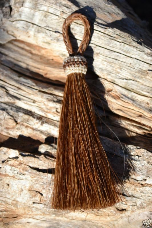 Close Up View  3" - 4 1/2" total length natural horsehair tassels. Handmade with 1 1/2" braided horsehair knot loop.    Chestnut