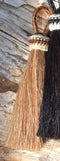 Close Up View 3" - 4 1/2" total length natural horsehair tassels. Handmade with 1 1/2" braided horsehair knot loop.     Sorrel