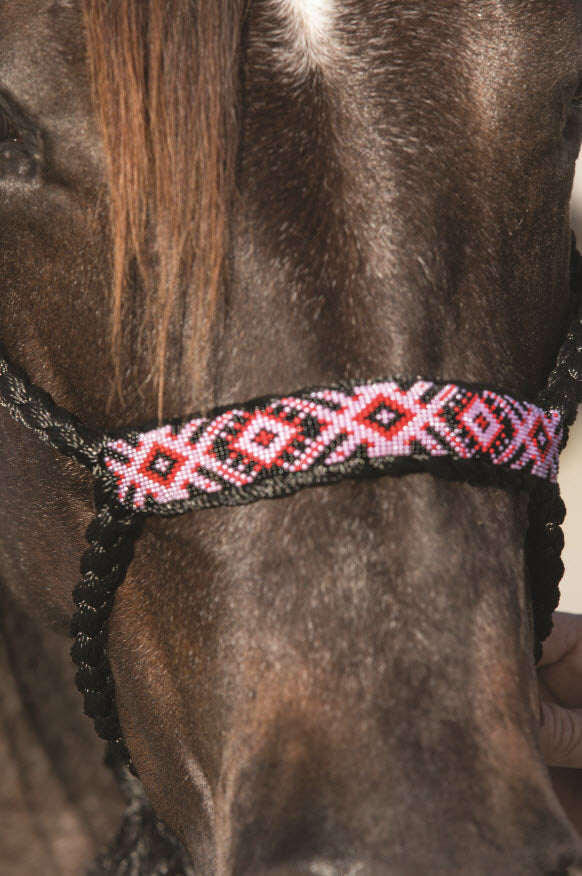 Black/Pink - A braided soft yet sturdy mule tape rope halter that features a flat nose and comes complete with a matching ten foot lead. Beaded nose band gives a fun fashion flare to the noseband. 