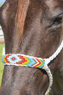 White/Red - A braided soft yet sturdy mule tape rope halter that features a flat nose and comes complete with a matching ten foot lead. Beaded nose band gives a fun fashion flare to the noseband. 