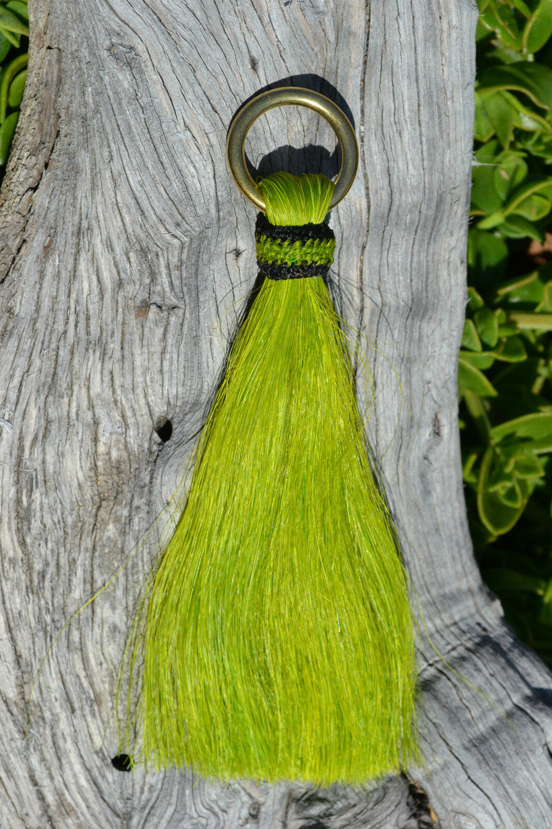 Close Up View  6" - brightly colored shu-fly tassels with 1" brass ring. Handmade from 100% natural mane horsehair dyed in bright colors.    Lime