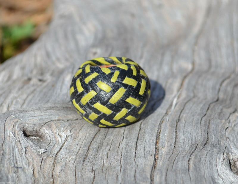 Close up View Hand braided rawhide scarf slide.  Custom made in two-tone combinations of black and bright colored leather braided in a custom "checkerboard" pattern.    Lime/Black