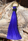 Close Up View 6" - brightly colored shu-fly tassels with 1" brass ring. Handmade from 100% natural mane horsehair dyed in bright colors.    Purple