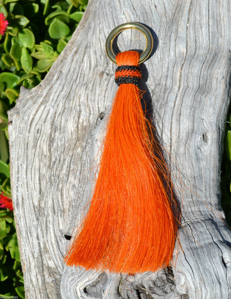 Close Up View 6" - brightly colored shu-fly tassels with 1" brass ring. Handmade from 100% natural mane horsehair dyed in bright colors.   Orange