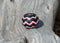 Hand braided rawhide scarf slide.  Custom made in two-tone combinations of black and bright colored leather braided in a "zig zag" pattern.          Pink/Black