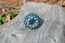 Detailed View  Hand braided rawhide scarf slide. Custom made in two-tone combinations of black and bright colored leather braided in a custom "checkerboard" pattern.   Turquoise/Black