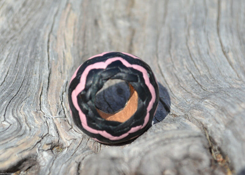 Hand braided rawhide scarf slide.  Custom made in two-tone combinations of black and bright colored leather braided in a "zig zag" pattern.                   Pink/Black