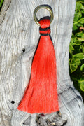 Close Up View 6" - brightly colored shu-fly tassels with 1" brass ring. Handmade from 100% natural mane horsehair dyed in bright colors.   Red